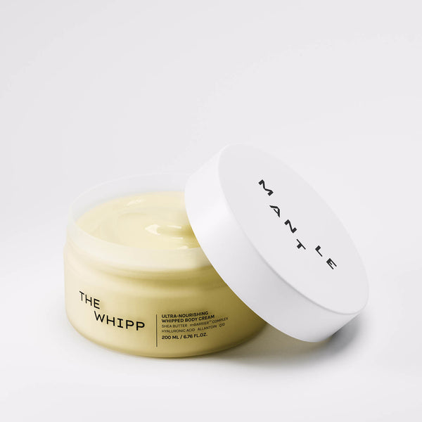 One open jar of The Whipp by MANTLE - an award-winning, ultra-nourishing whipped body cream